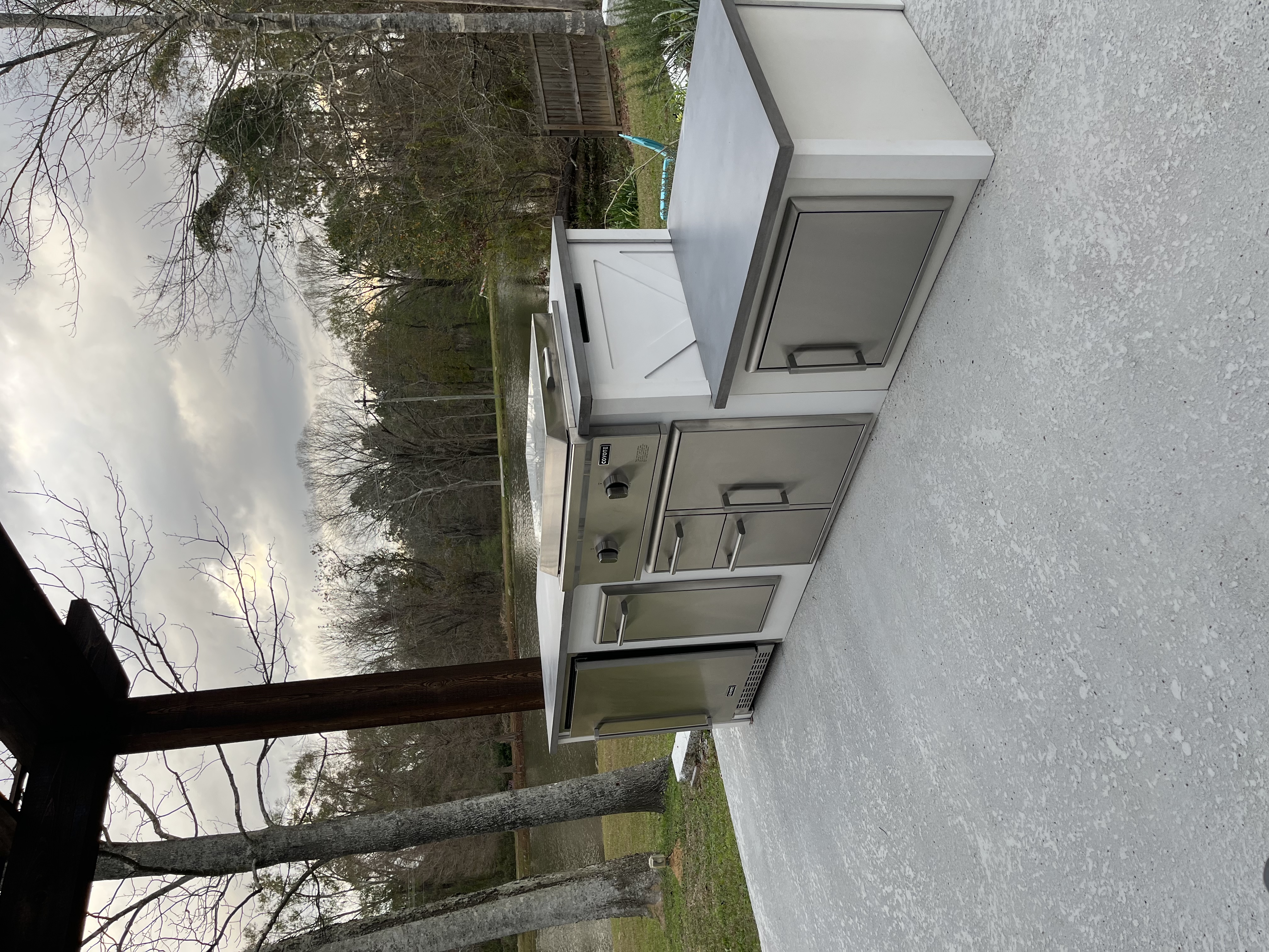 Coyote outdoor kitchen overlooking a lake
